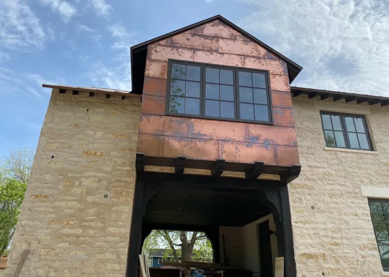 Copper metal panel facade on a stone building for Skylight Installation in Riverside